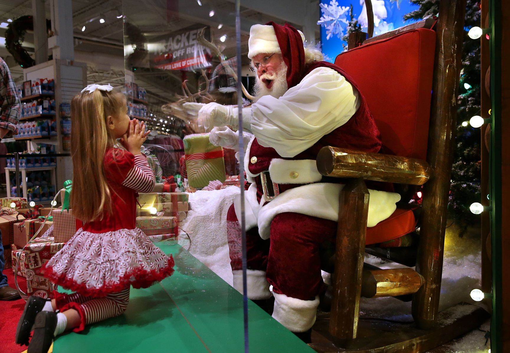 Sanitized Santa appears behind the glass